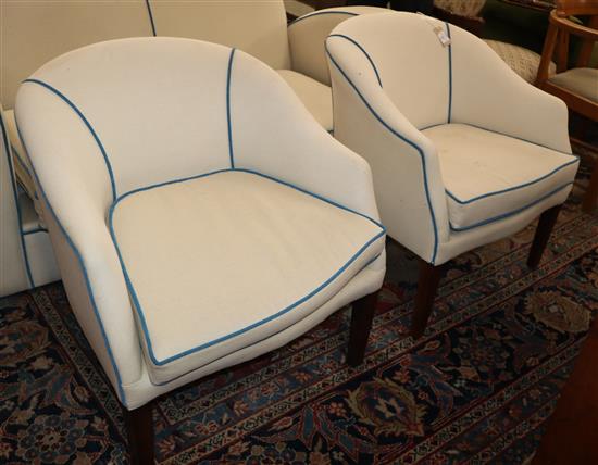 A pair of upholstered tub chairs